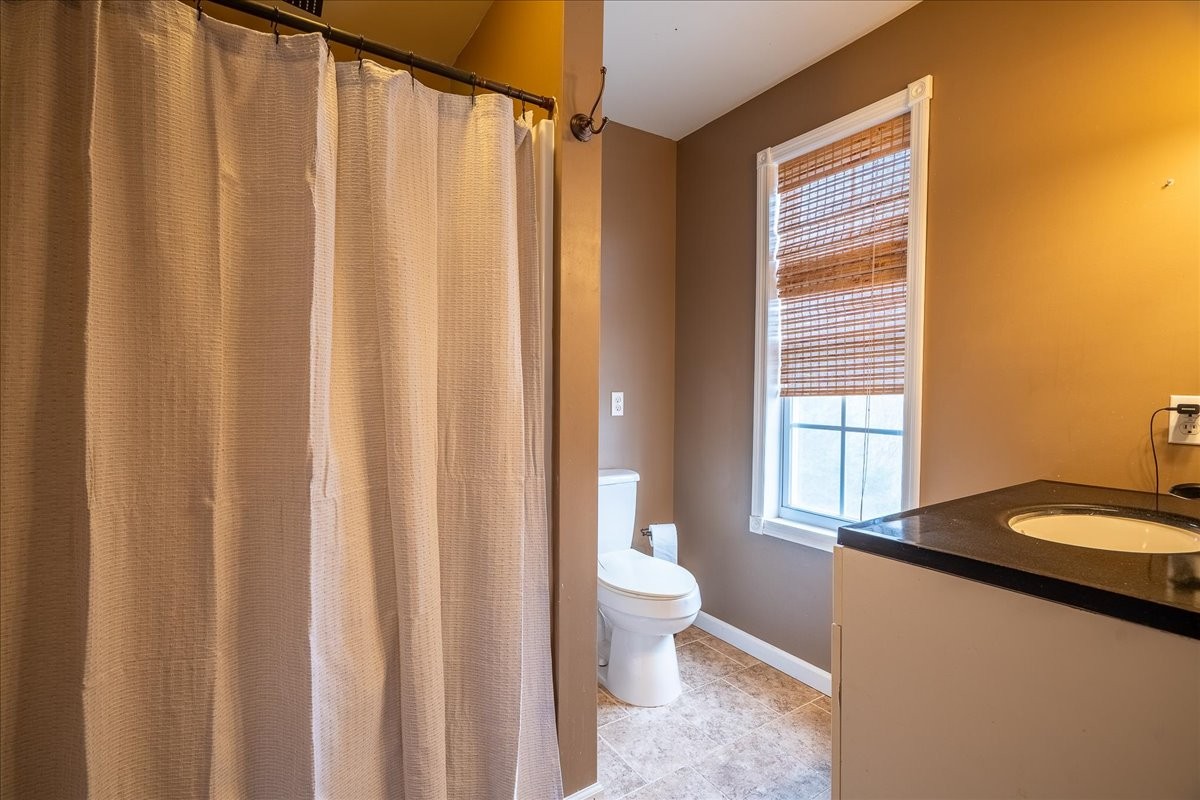 226 Nash Road Summertown, TN 38483 - Photo 29 of 55 a bathroom with a granite countertop sink and a mirror