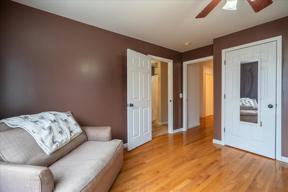 226 Nash Road Summertown, TN 38483 - Photo 31 of 55 a bedroom with a bed and a chandelier