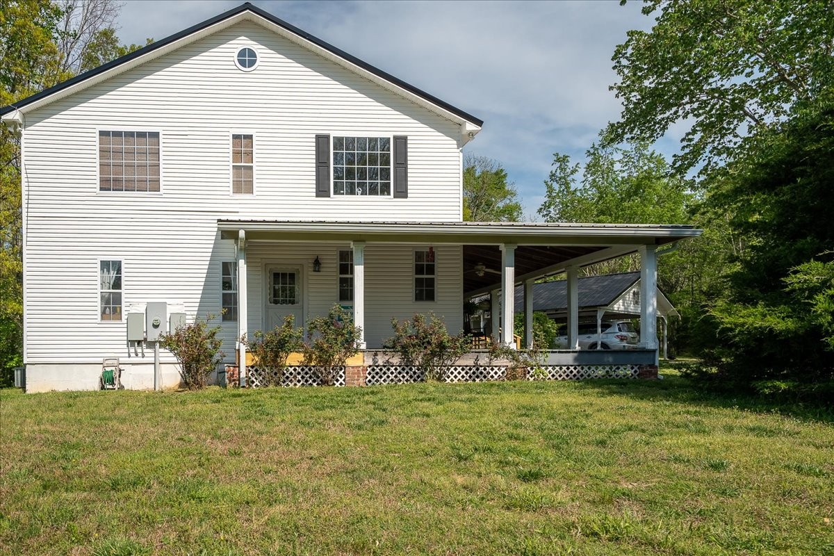 226 Nash Road Summertown, TN 38483 - Photo 42 of 55 a front view of a house with garden