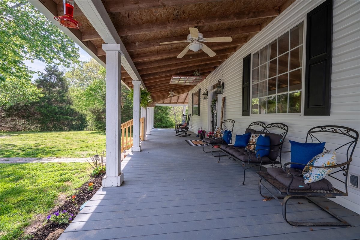 226 Nash Road Summertown, TN 38483 - Photo 47 of 55 a view of a porch with wooden floor and outdoor seating