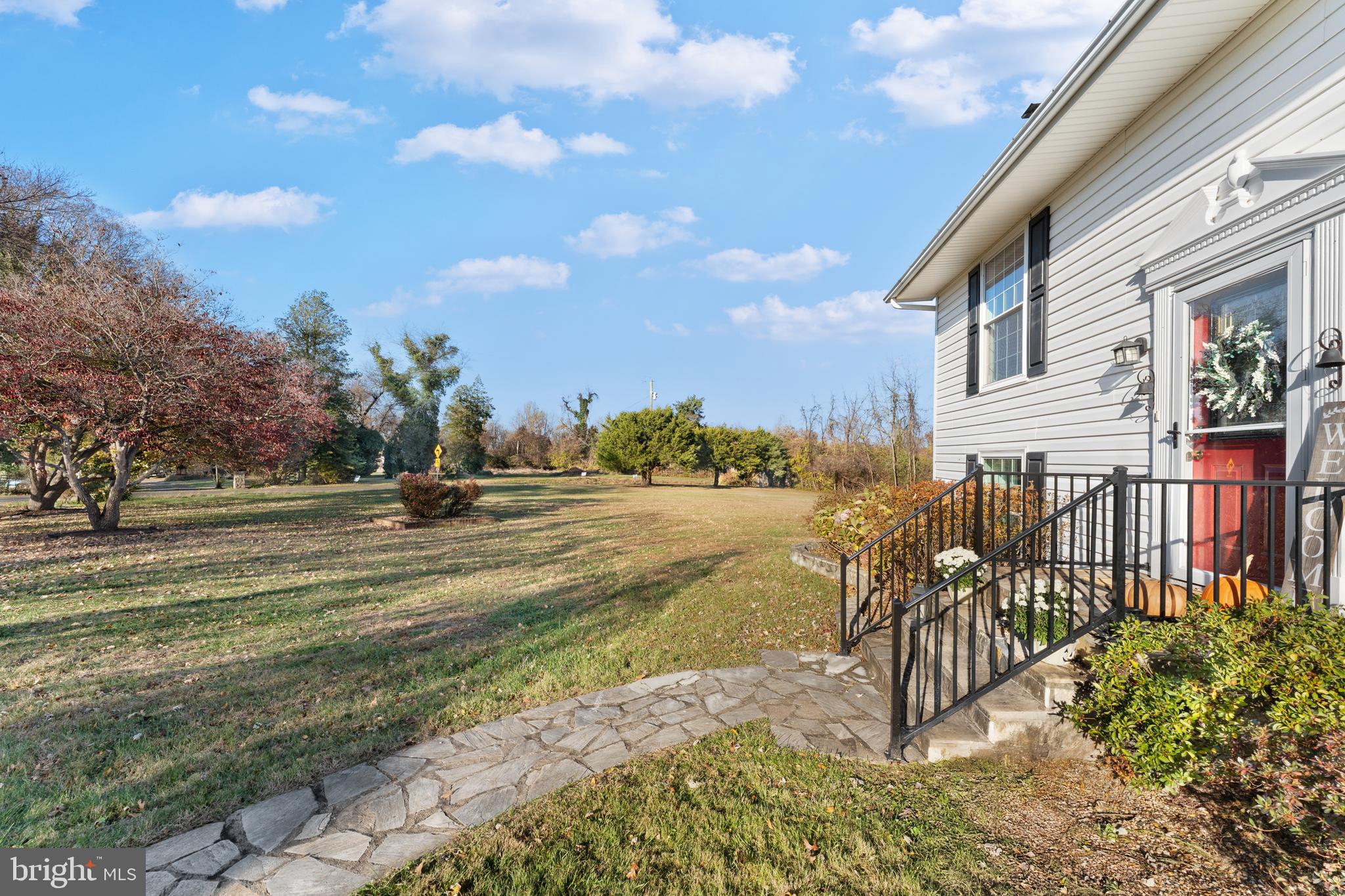 5057 Old Auburn Road Warrenton, VA 20187 - Photo 11 of 47 a view of a yard with yellow house