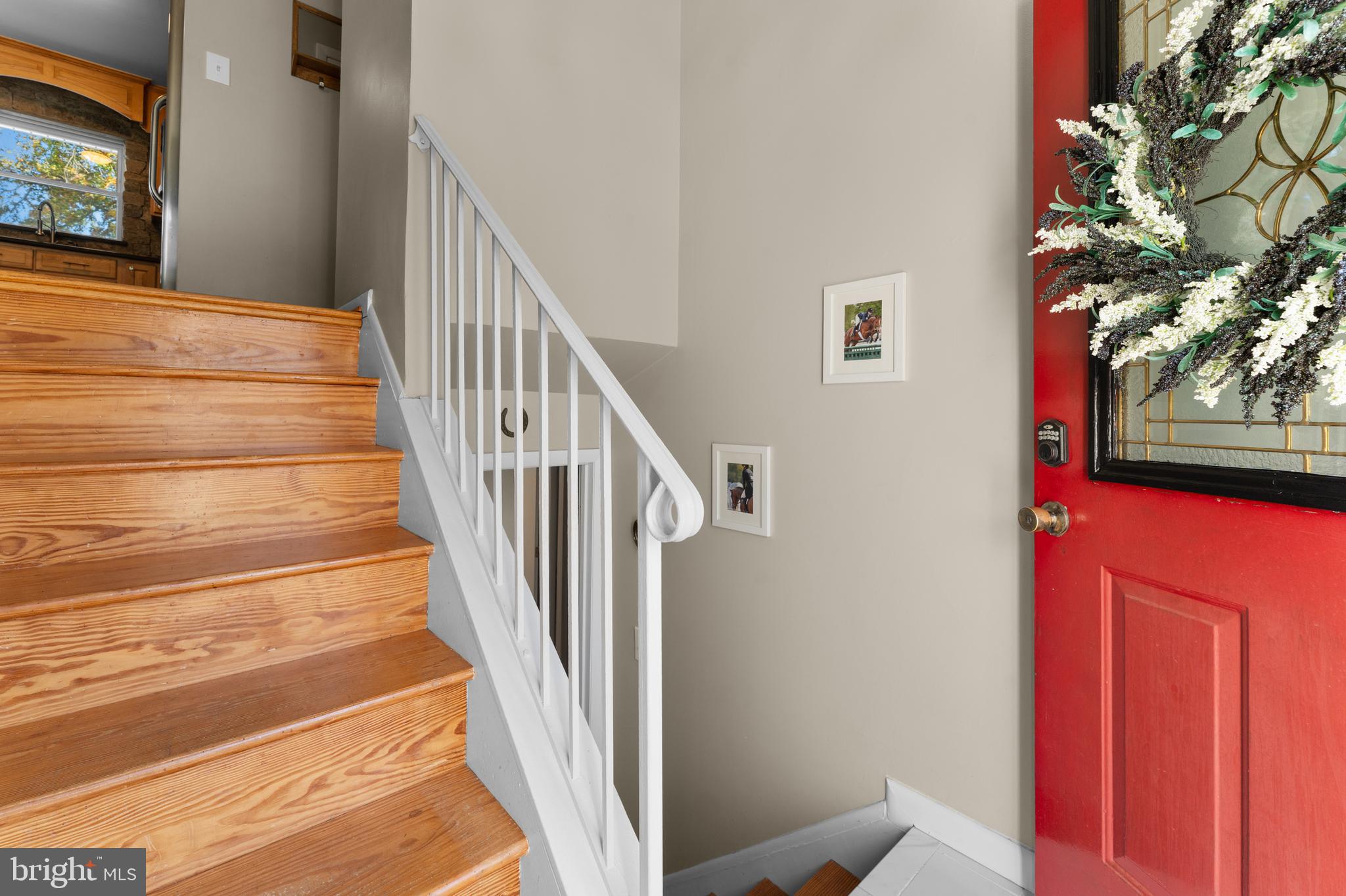 5057 Old Auburn Road Warrenton, VA 20187 - Photo 15 of 47 a view of staircase with wooden floor and a rug