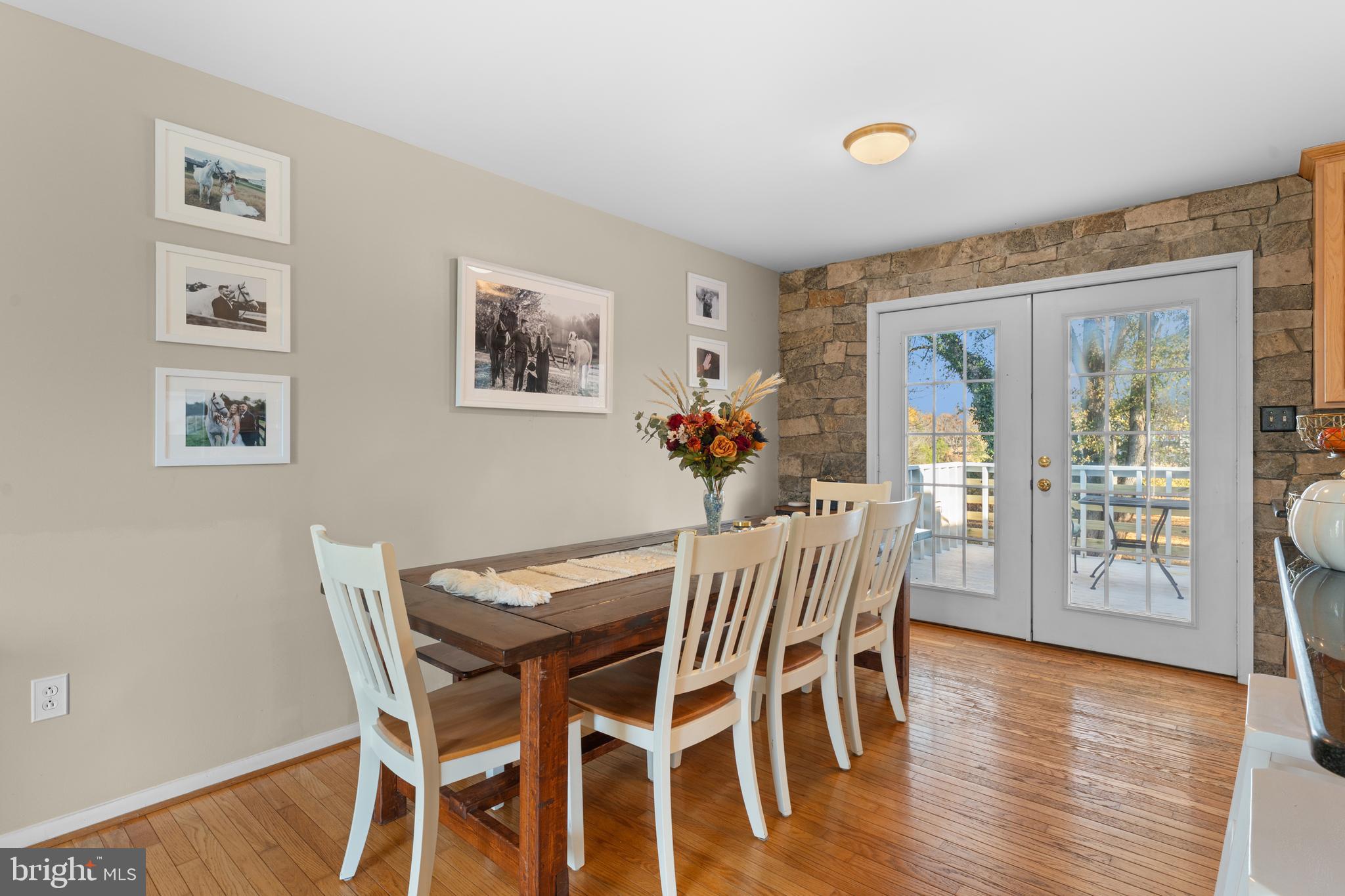 5057 Old Auburn Road Warrenton, VA 20187 - Photo 17 of 47 a view of a dining room with furniture and wooden floor
