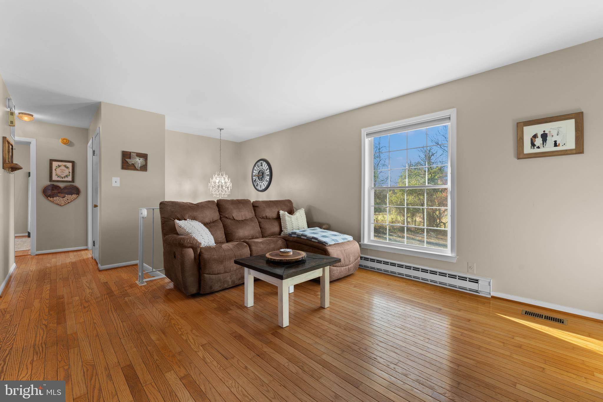 5057 Old Auburn Road Warrenton, VA 20187 - Photo 23 of 47 a living room with furniture and a wooden floor