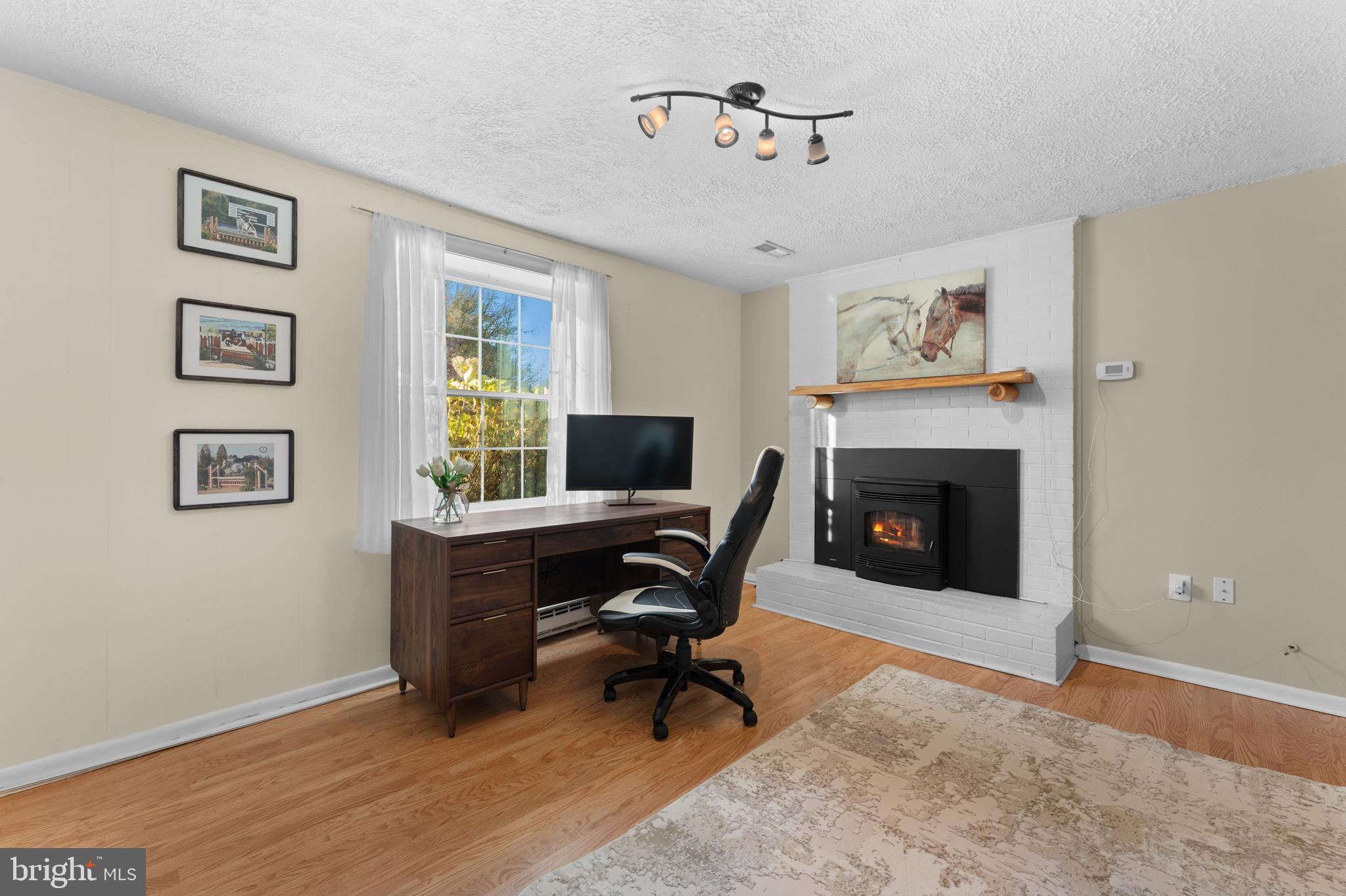 5057 Old Auburn Road Warrenton, VA 20187 - Photo 31 of 47 a view of a workspace with furniture and a window