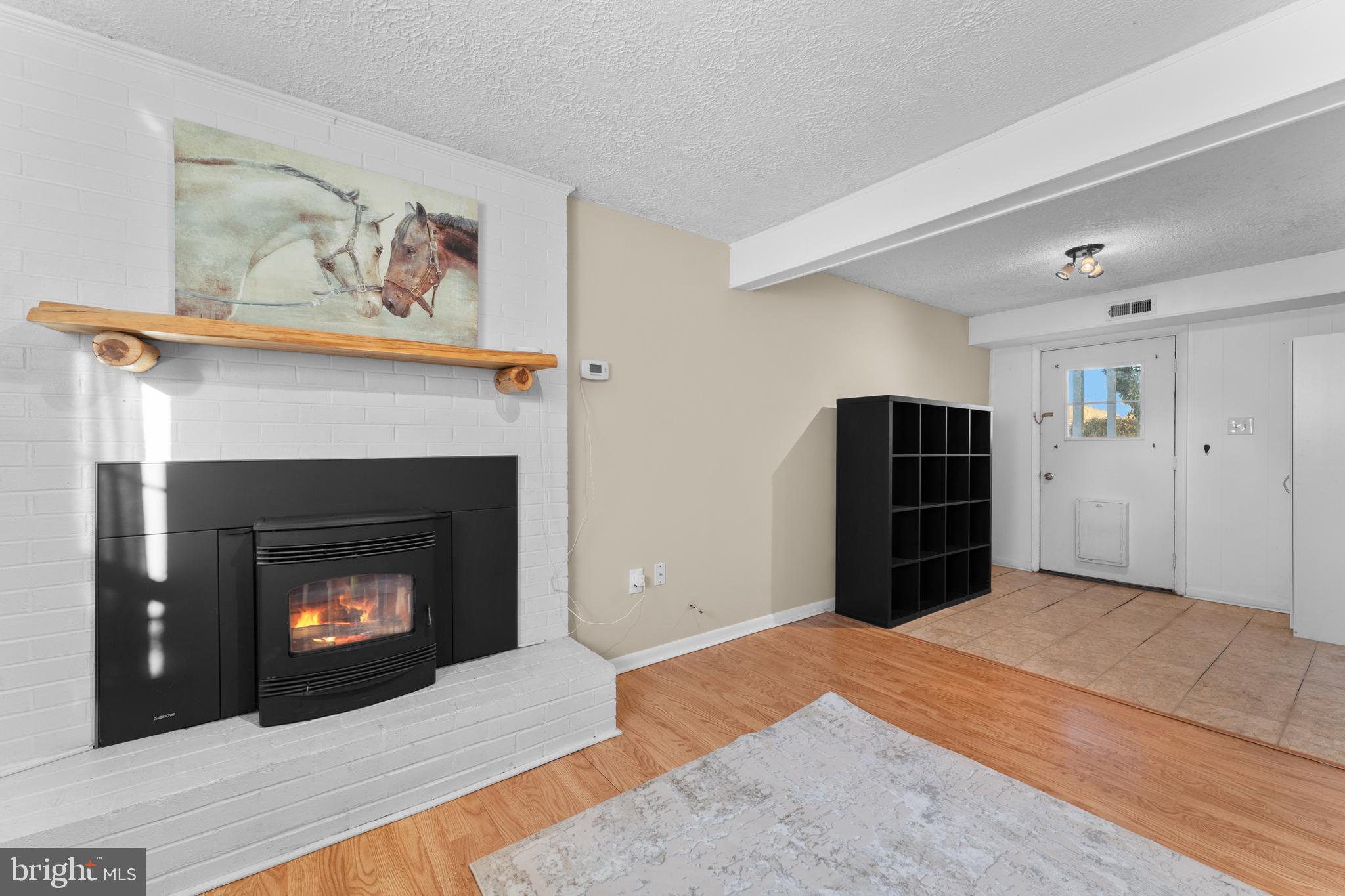 5057 Old Auburn Road Warrenton, VA 20187 - Photo 33 of 47 a bedroom with a bed and a fireplace