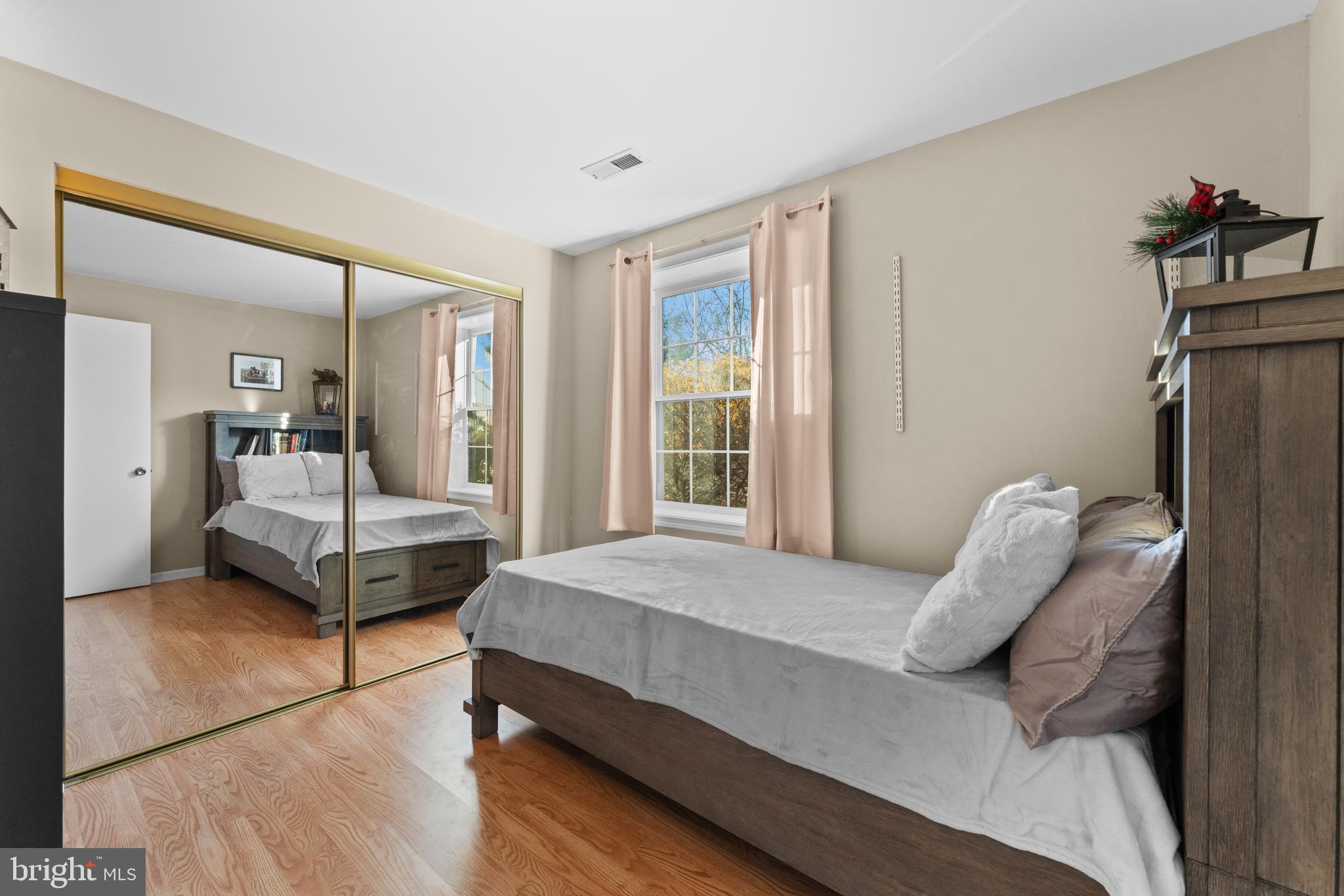 5057 Old Auburn Road Warrenton, VA 20187 - Photo 34 of 47 a bedroom with a bed and wooden floor