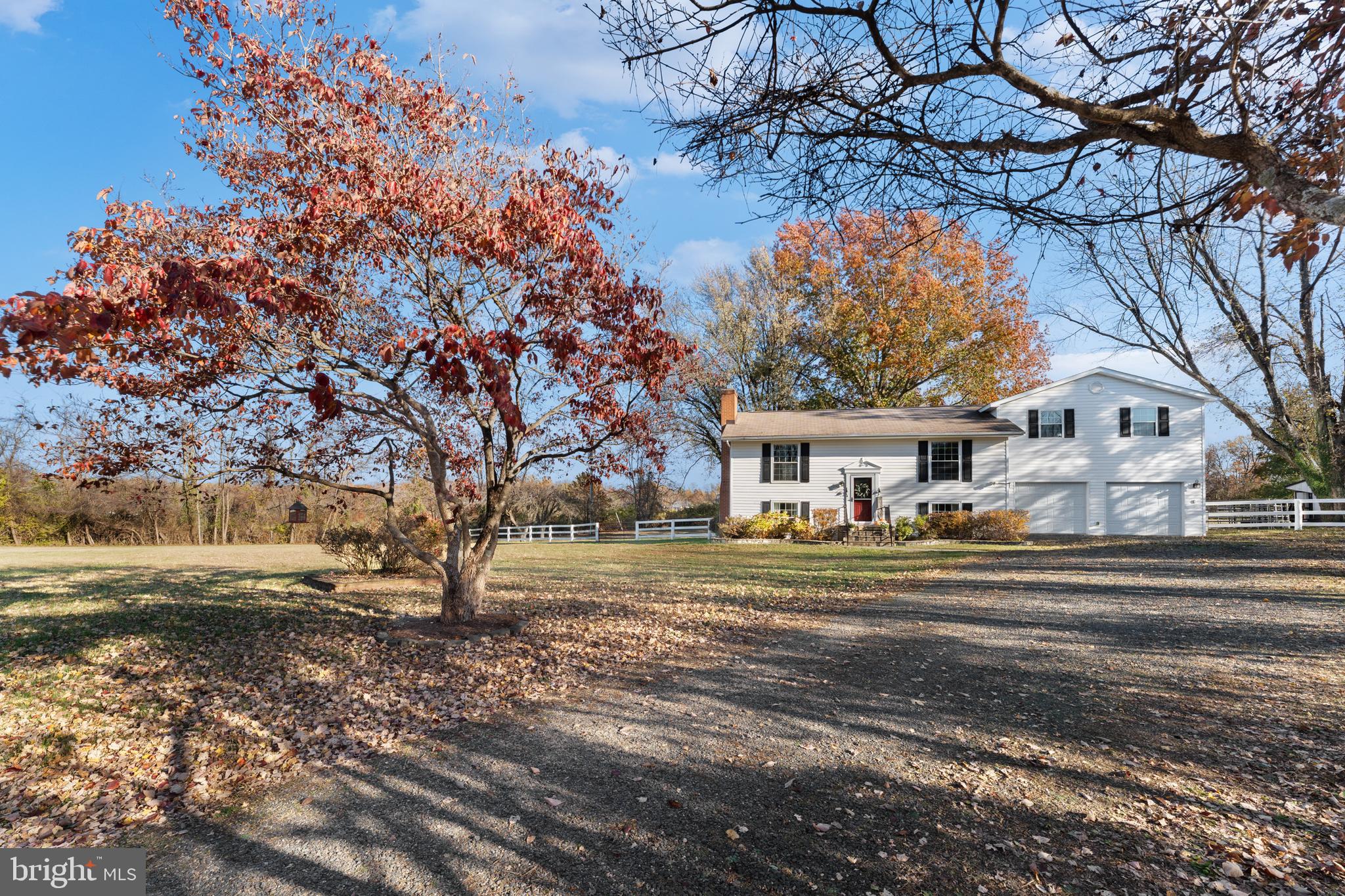 5057 Old Auburn Road Warrenton, VA 20187 - Photo 4 of 47 a front view of a house with a yard