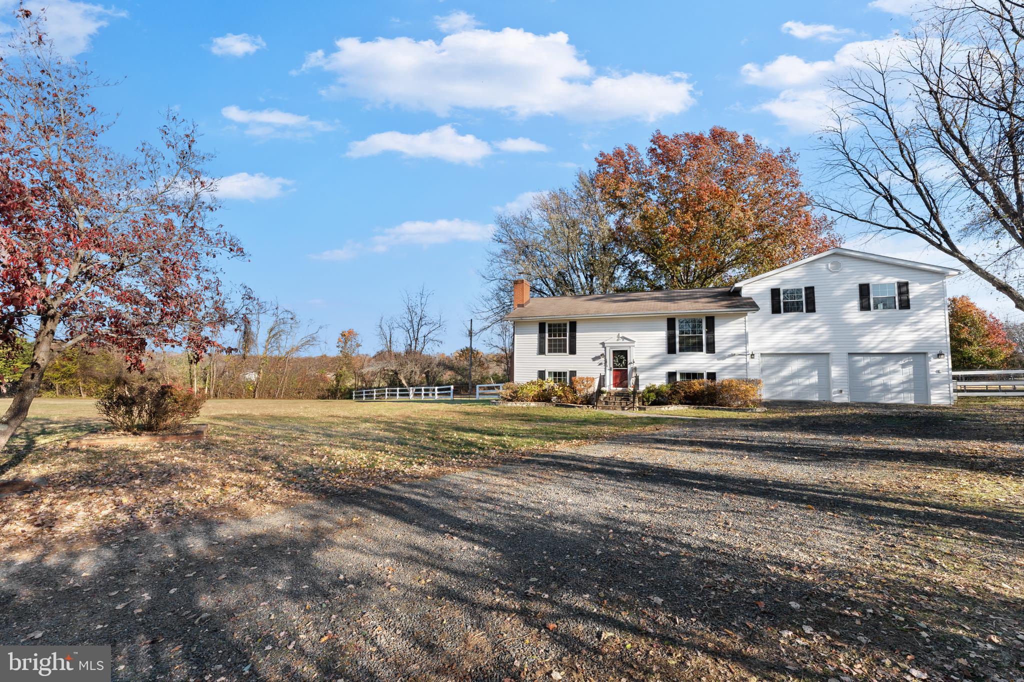 5057 Old Auburn Road Warrenton, VA 20187 - Photo 5 of 47 a view of a house with a yard and large trees