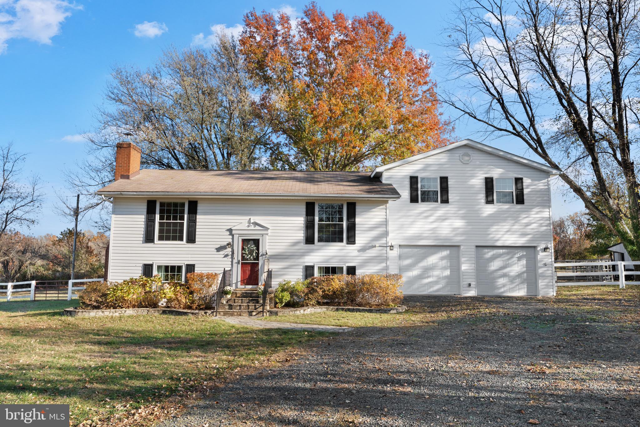 5057 Old Auburn Road Warrenton, VA 20187 - Photo 6 of 47 a front view of a house with a yard