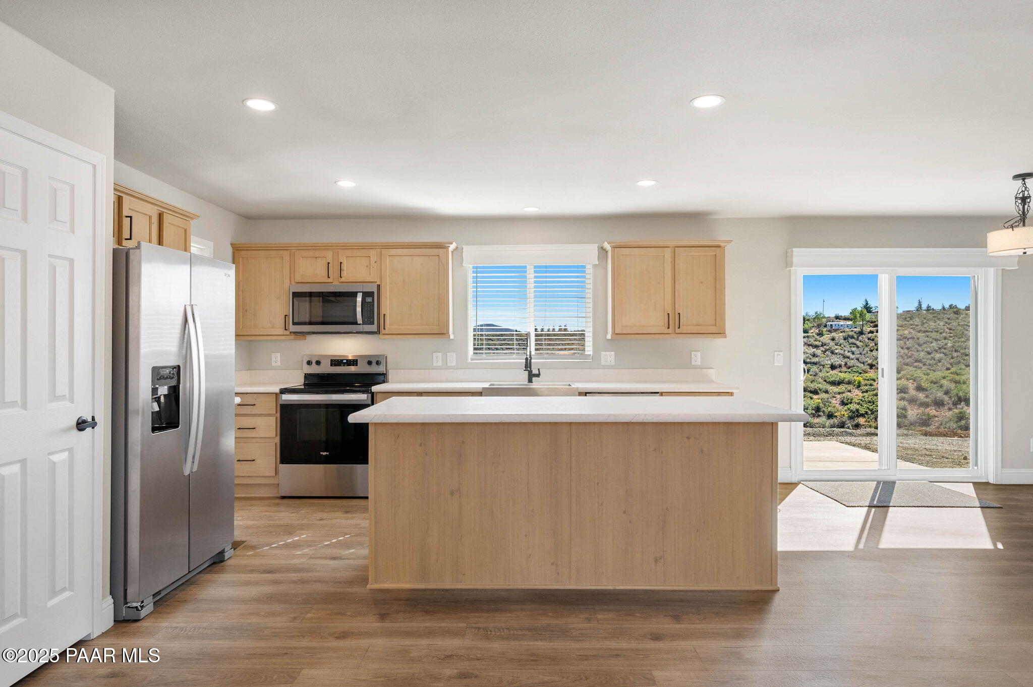 9815 East Ringold Road Dewey, AZ 86327 - Photo 12 of 25 a kitchen with stainless steel appliances a refrigerator stove microwave and sink