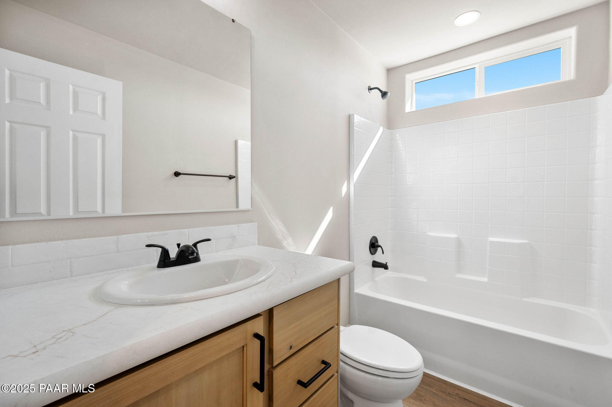 9815 East Ringold Road Dewey, AZ 86327 - Photo 17 of 25 a bathroom with a sink a toilet and a large mirror