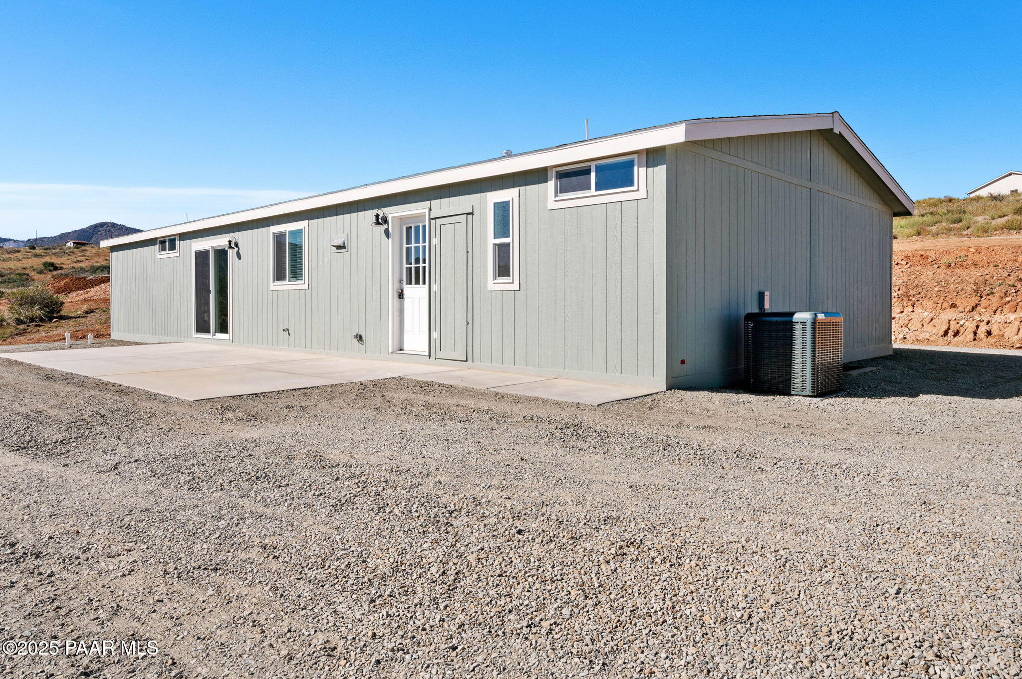 9815 East Ringold Road Dewey, AZ 86327 - Photo 4 of 25 a front view of a house with a yard