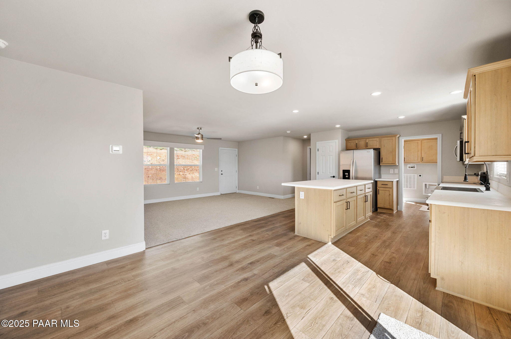 9815 East Ringold Road Dewey, AZ 86327 - Photo 10 of 25 a large kitchen with a lot of cabinets and wooden floor