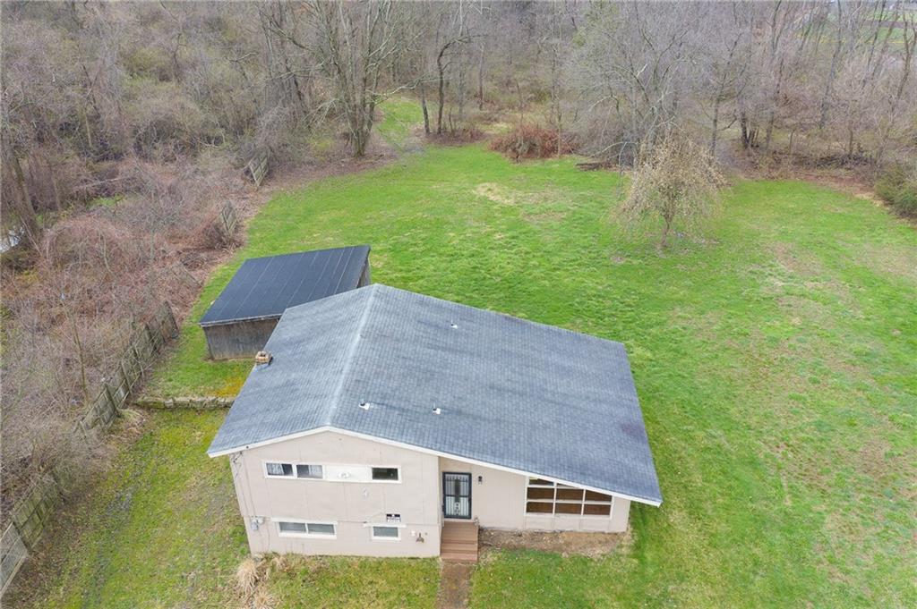 81 Ewing Road McKees Rocks, PA 15136 - Photo 2 of 14 a view of a back yard of the house