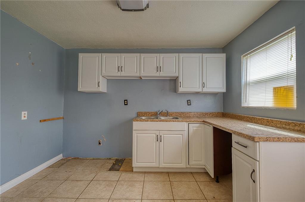 81 Ewing Road McKees Rocks, PA 15136 - Photo 6 of 14 a kitchen with a sink and cabinets