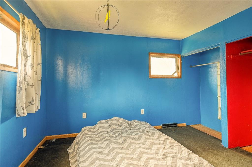 81 Ewing Road McKees Rocks, PA 15136 - Photo 7 of 14 a bedroom with a bed and a window