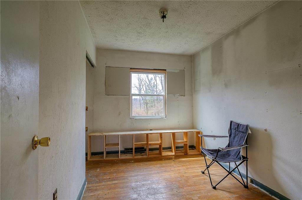 81 Ewing Road McKees Rocks, PA 15136 - Photo 9 of 14 a living room with furniture and a window