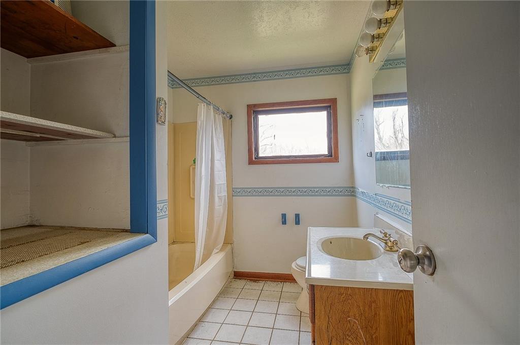 81 Ewing Road McKees Rocks, PA 15136 - Photo 10 of 14 a bathroom with a sink toilet and shower