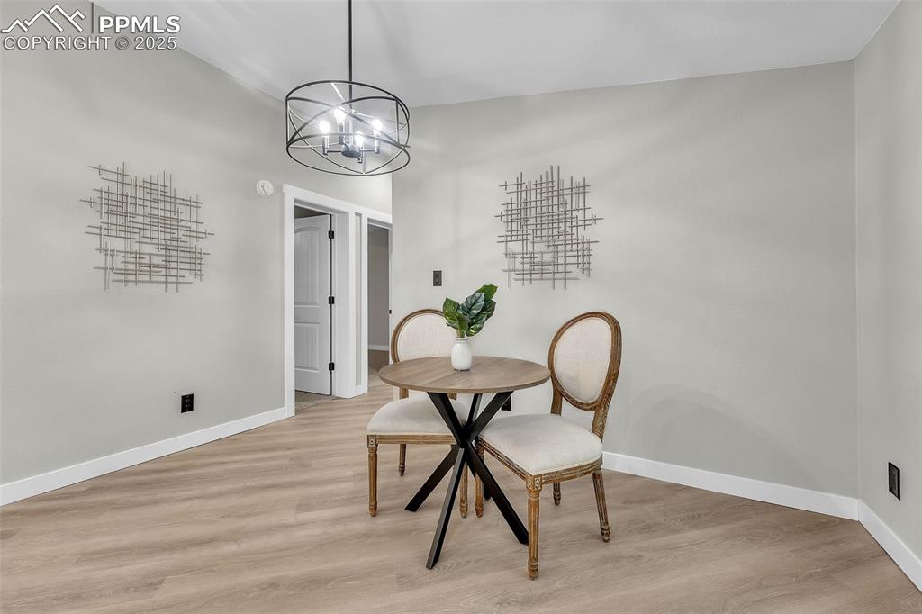 6185 Night Train Lane Yoder, CO 80864 - Photo 24 of 38 a view of a room that has a table and chairs