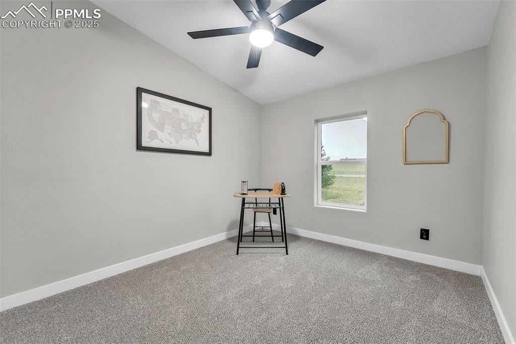 6185 Night Train Lane Yoder, CO 80864 - Photo 25 of 38 a view of workspace with window and ceiling fan