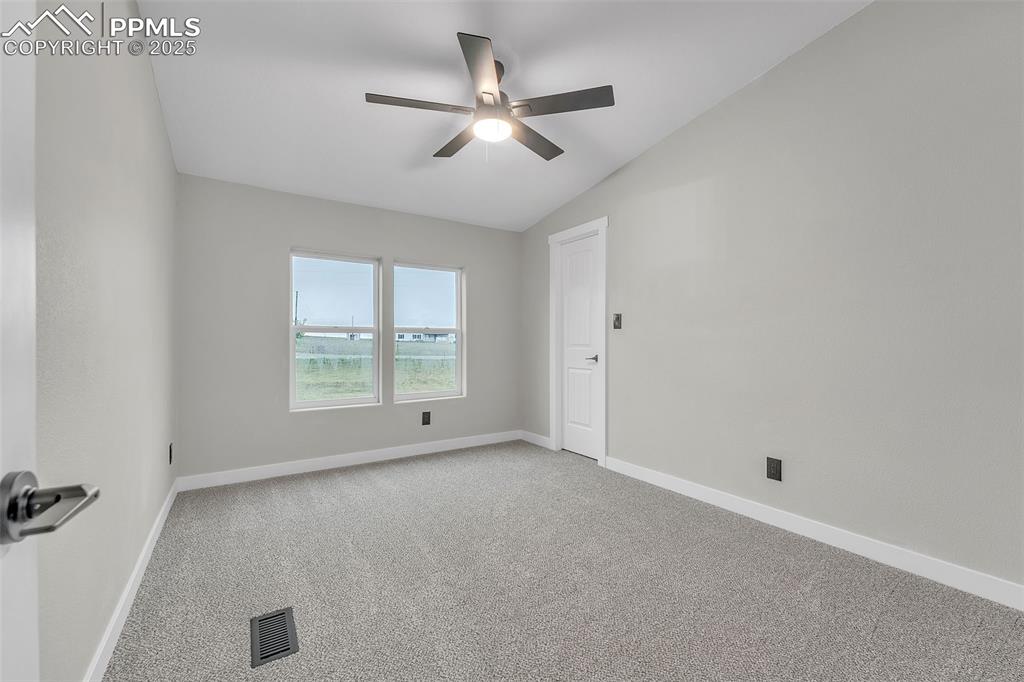 6185 Night Train Lane Yoder, CO 80864 - Photo 28 of 38 a view of an empty room with a window