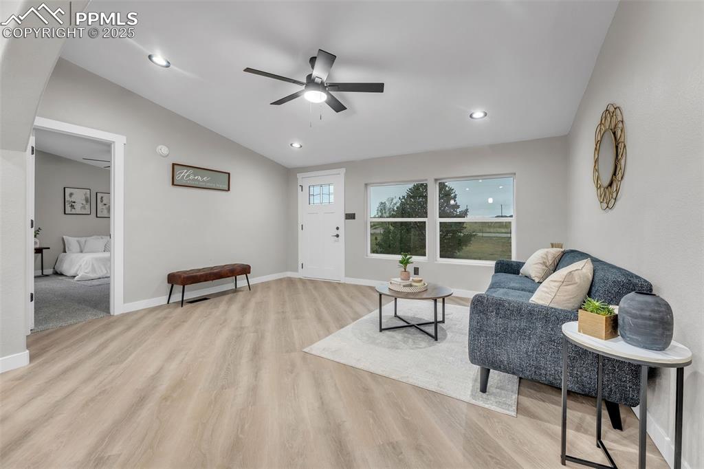 6185 Night Train Lane Yoder, CO 80864 - Photo 4 of 38 a living room with furniture and a window