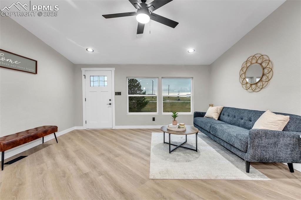 6185 Night Train Lane Yoder, CO 80864 - Photo 5 of 38 a living room with furniture and a large window