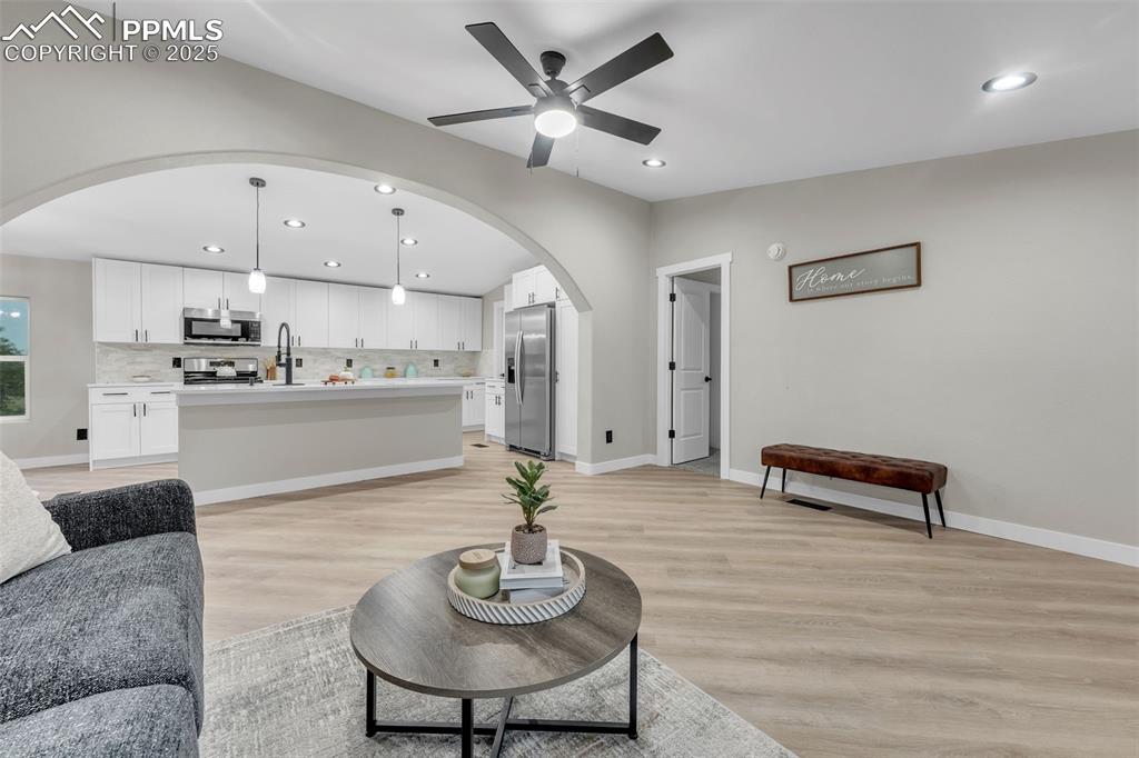 6185 Night Train Lane Yoder, CO 80864 - Photo 7 of 38 a living room with kitchen and furniture