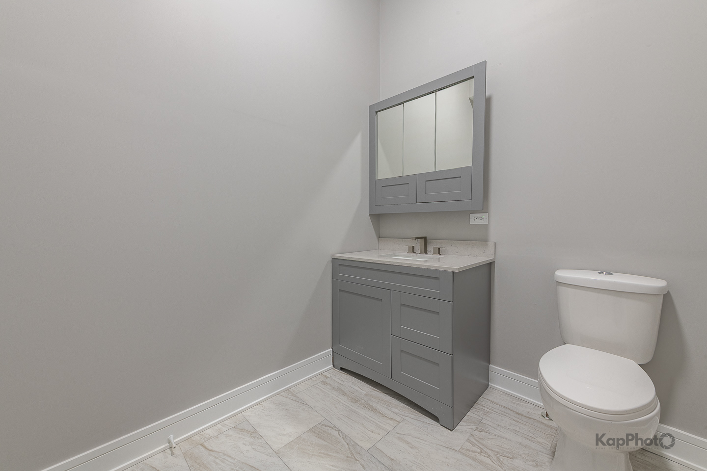 3044 West Irving Park Road Chicago, IL 60618 - Photo 11 of 37 a bathroom with a toilet sink and mirror