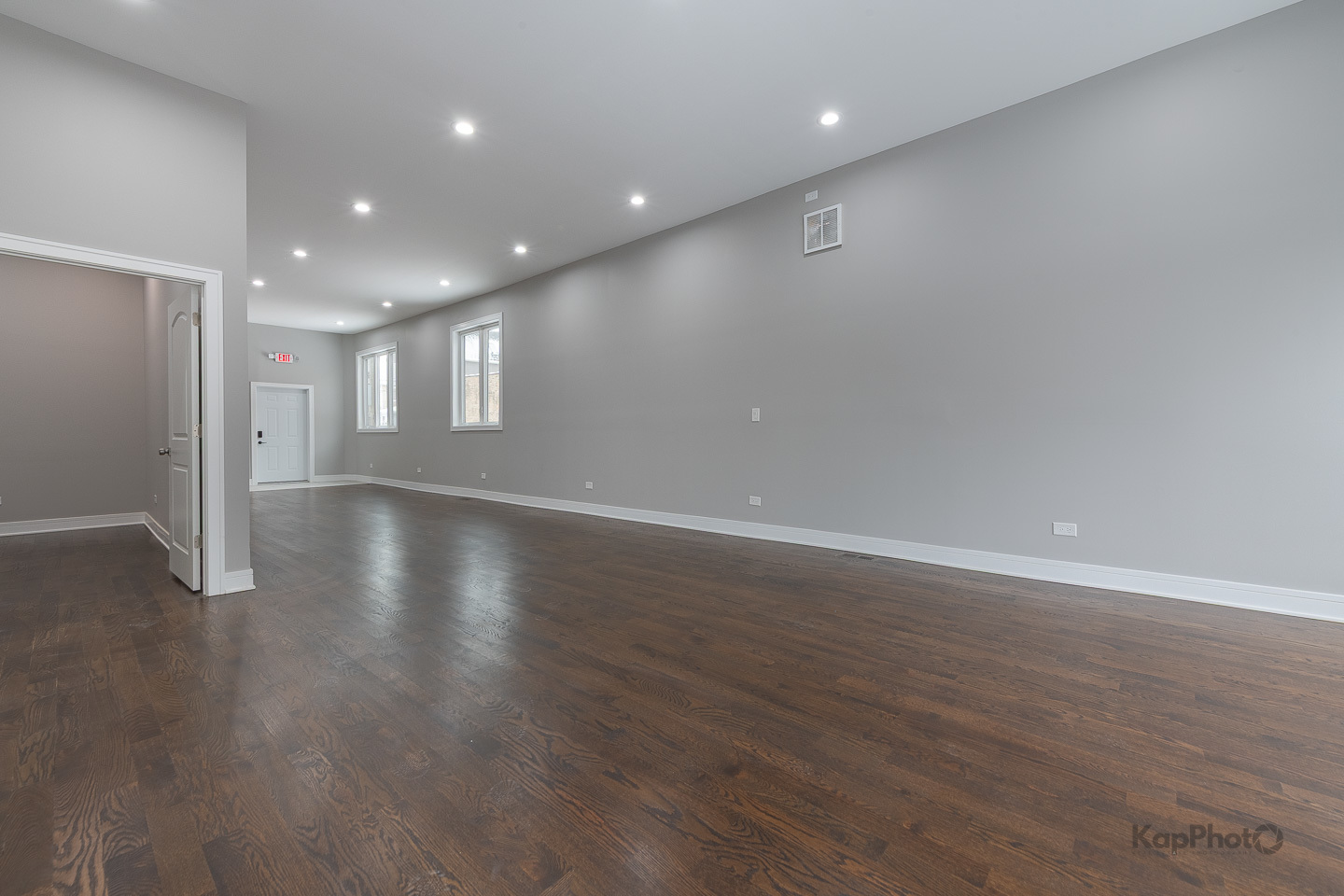 3044 West Irving Park Road Chicago, IL 60618 - Photo 6 of 37 an empty room with wooden floor and windows