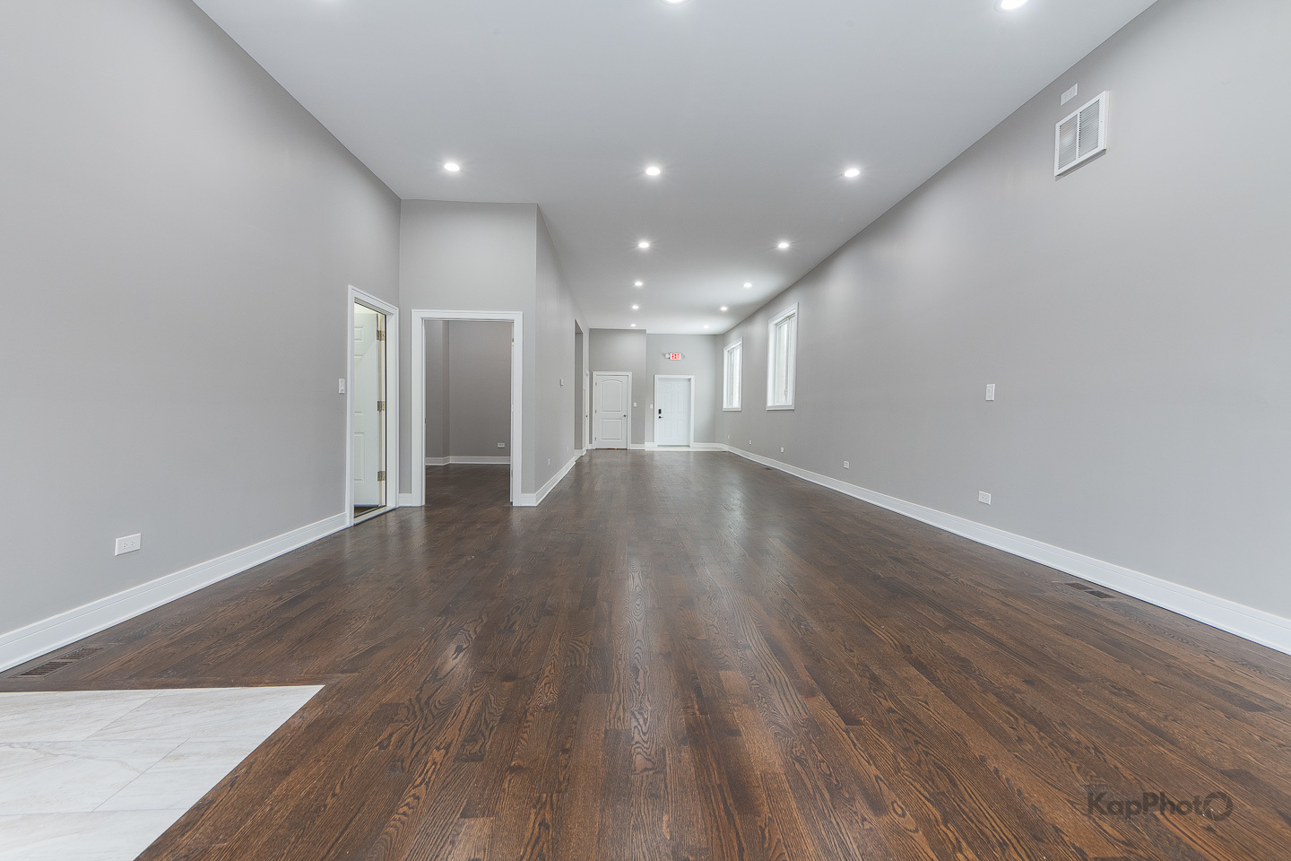 3044 West Irving Park Road Chicago, IL 60618 - Photo 7 of 37 a view of an empty room with wooden floor