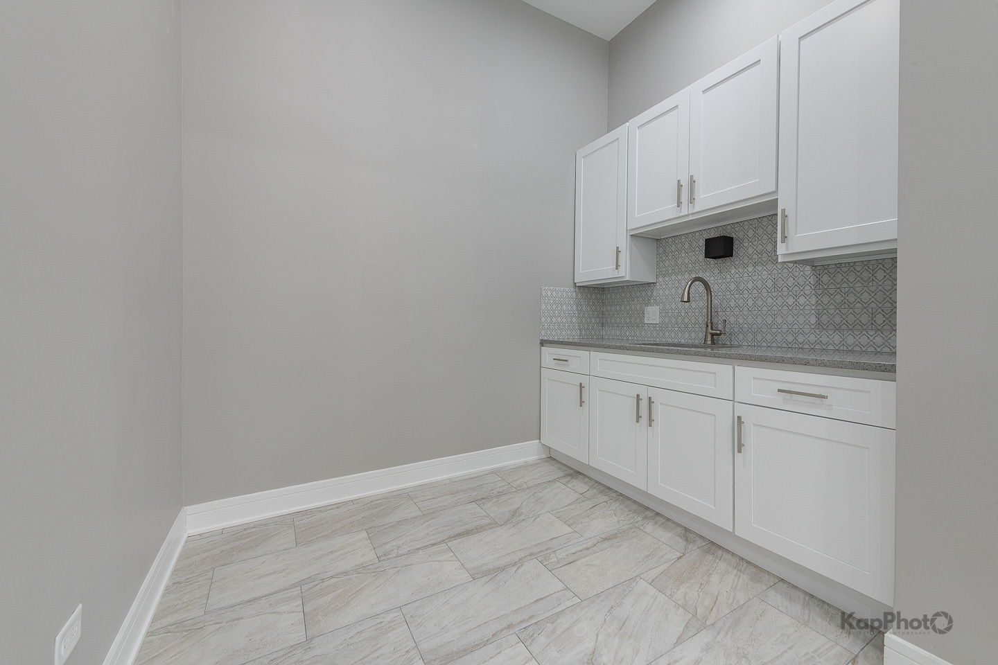3044 West Irving Park Road Chicago, IL 60618 - Photo 10 of 37 a view of cabinets a sink and dishwasher in a white cabinet