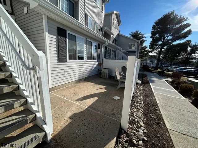 a view of a patio with a table and chairs