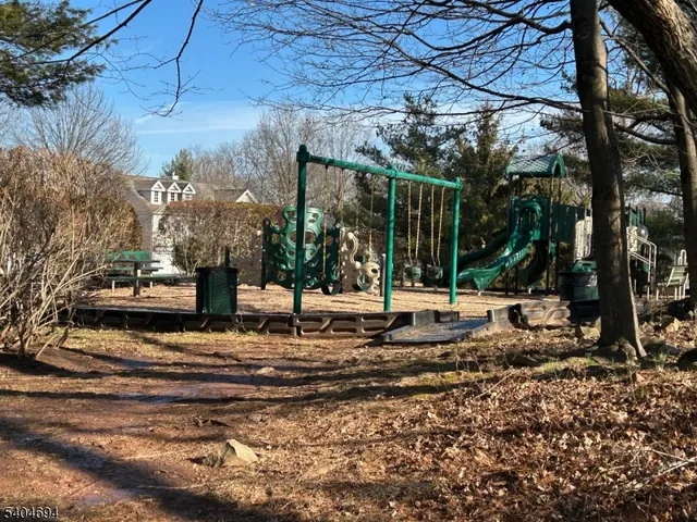 a view of a tree in front of a house