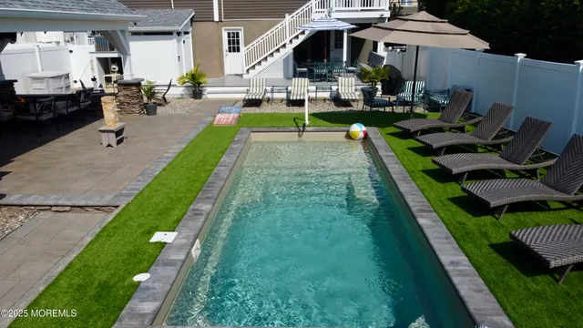a view of a house with sitting area and furniture