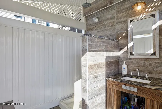 a living room with fireplace furniture and a wooden floor