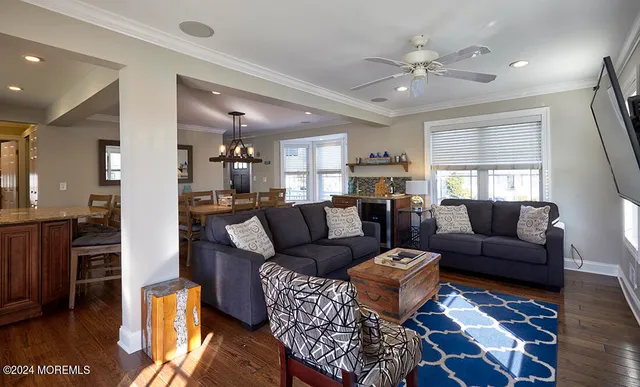 a bedroom with a bed and a flat tv screen on dresser