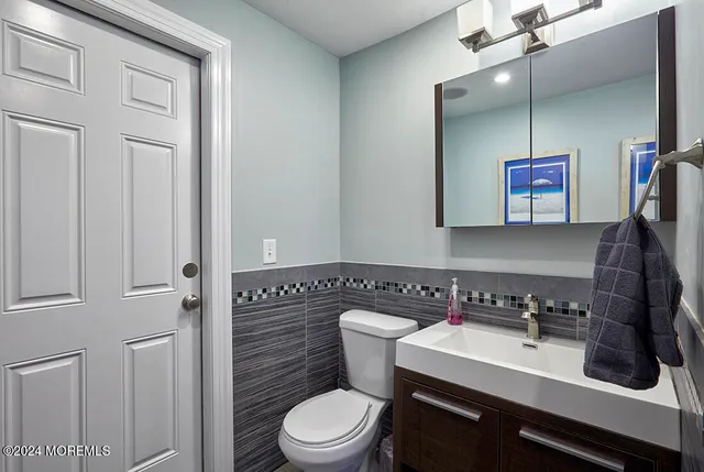 a bathroom with a black white checkered floor