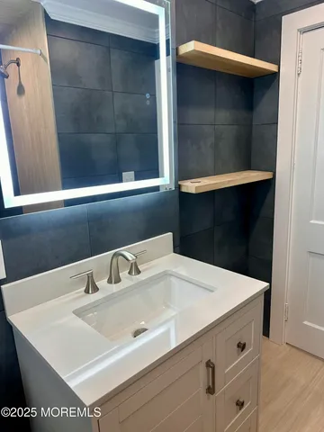 a dining room with furniture and a chandelier