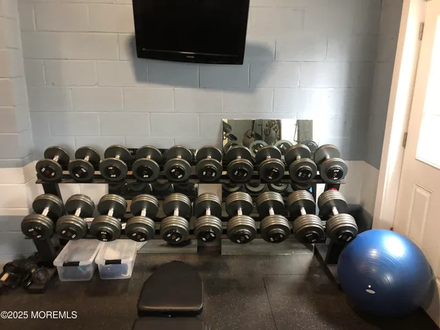 a room with furniture and a flat screen tv