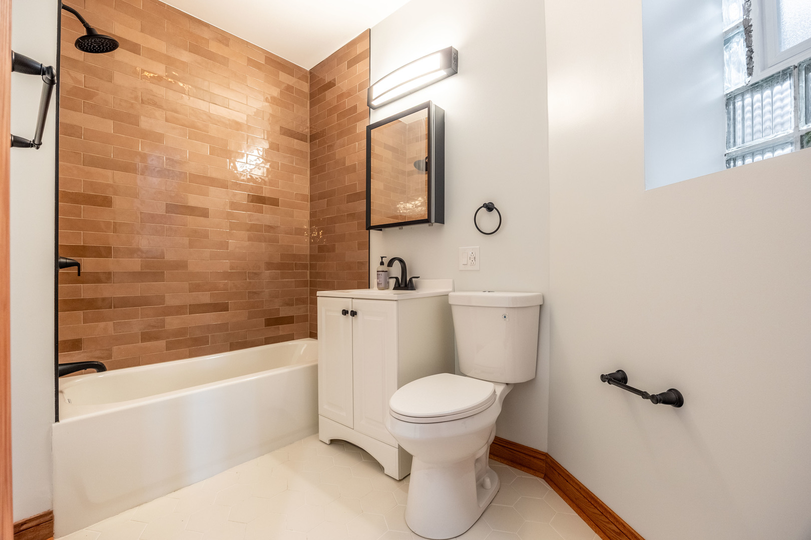 2842 West Augusta Boulevard, Unit 2E Chicago, IL 60622 - Photo 22 of 23 a bathroom with a toilet a sink and bathtub