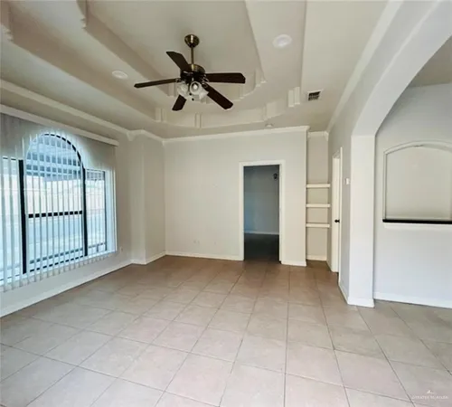a view of an empty room with a window