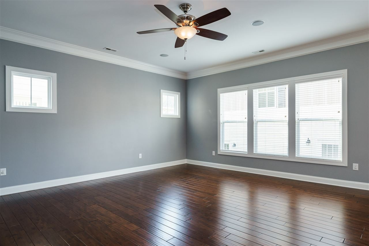 1334 Rodessa Run Raleigh, NC 27607 - Photo 11 of 25 DOWNSTAIRS FAMILY ROOM RIGHT OFF THE KITCHEN IS ALSO A "HOME THEATRE" WITH BUILT-IN WALL AND CEILING SPEAKERS. LIVING ROOM