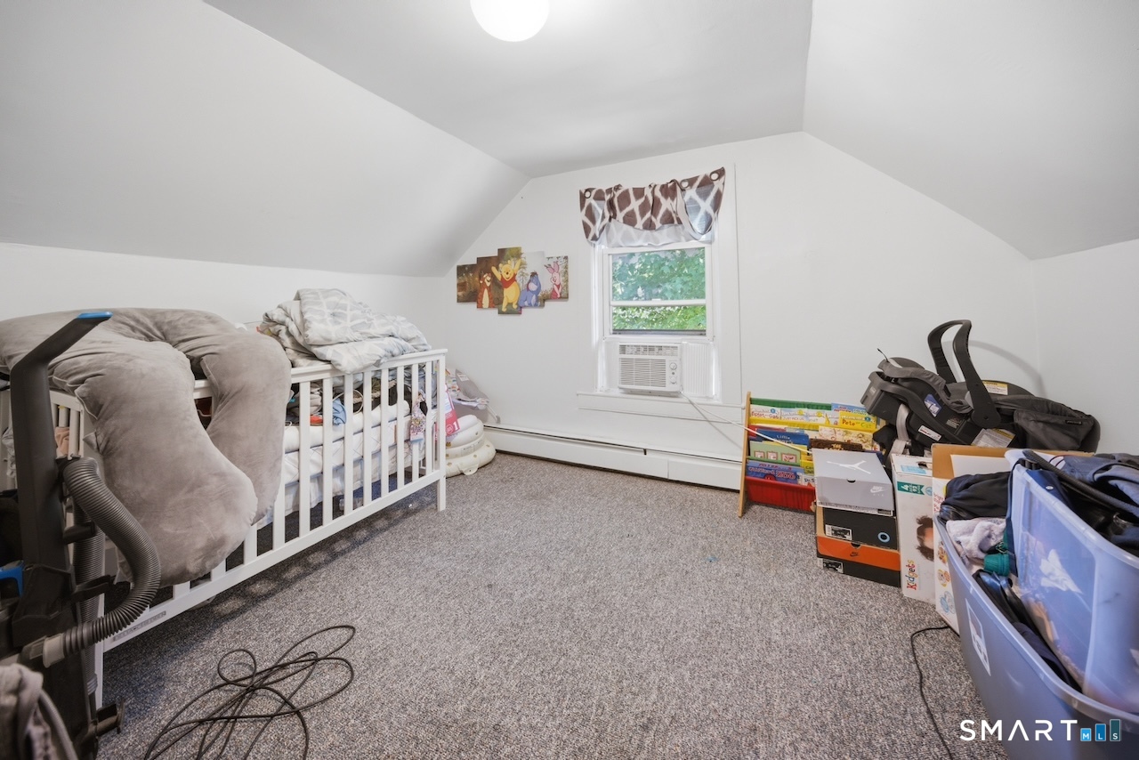 12 Webster Street Vernon, CT 06066 - Photo 23 of 33 a bedroom with furniture and a window