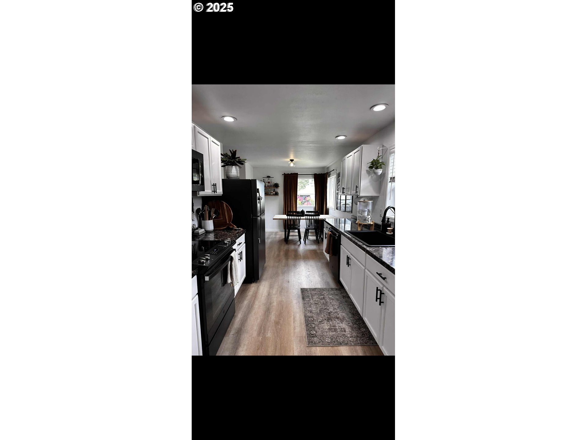 2136 Greenwood Avenue Reedsport, OR 97467 - Photo 12 of 20 a view of a living room with kitchen area
