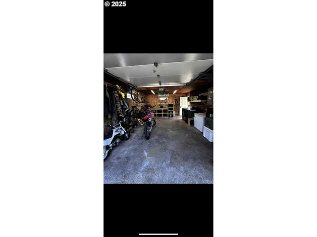 a view of a living room with a table and a potted plant