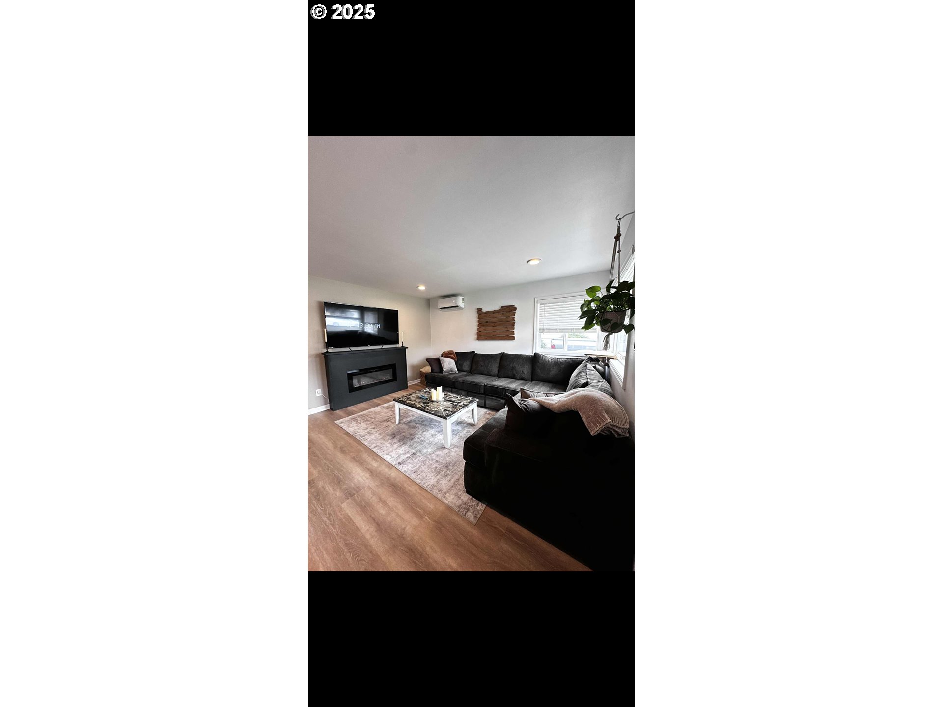 2136 Greenwood Avenue Reedsport, OR 97467 - Photo 9 of 20 a living room with furniture and a flat screen tv