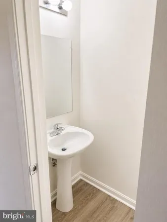 a bathroom with a sink and mirror