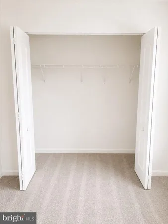 a view of room with a hallway